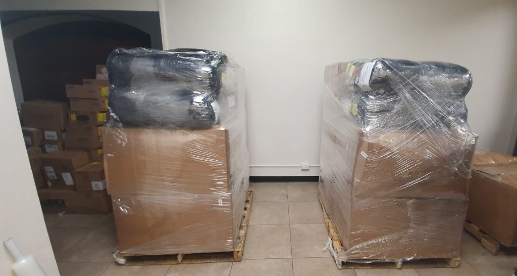 Palletized shipments wrapped and staged for transport